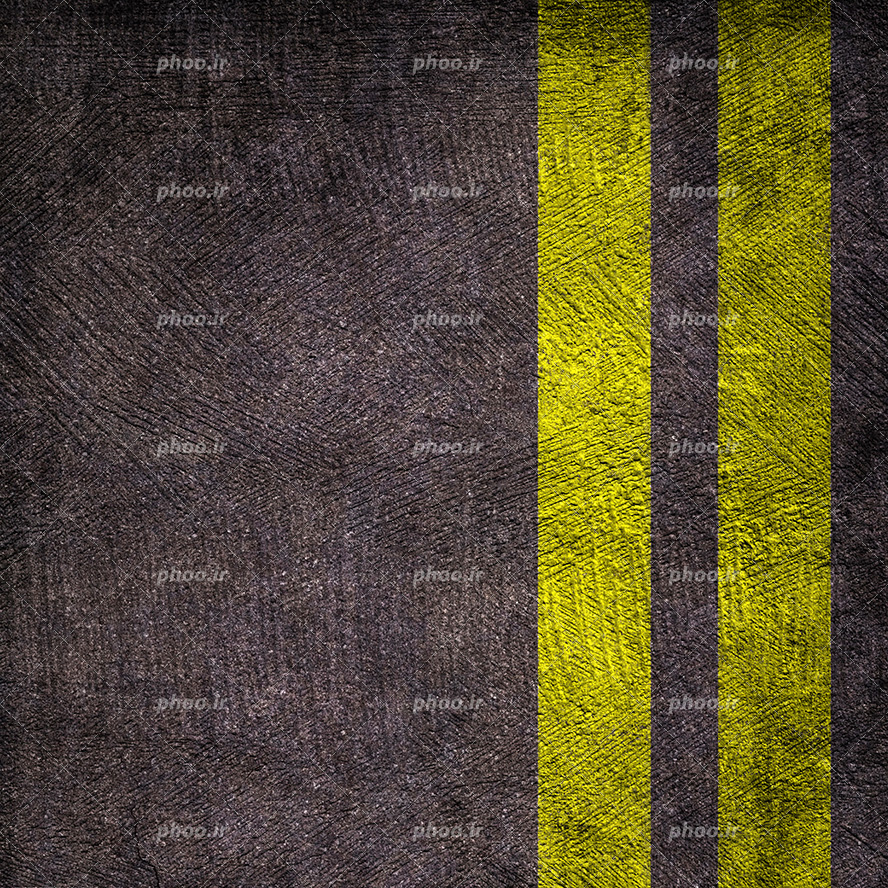 عکس با کیفیت دوخط موازی زرد بر روی زمین آسفالت شده از نمای نزدیک