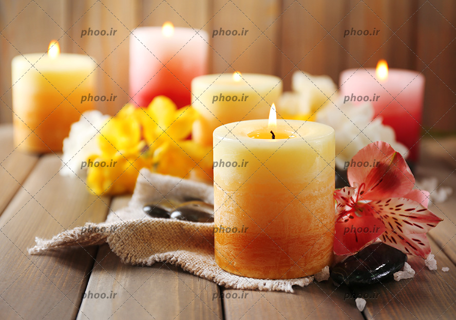 عکس سنگ ها و شمع ها و گل ها برای ماساژ