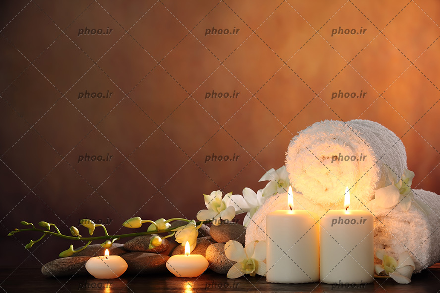 عکس زیبا شمع و سنگ و حوله واسه ماساژ